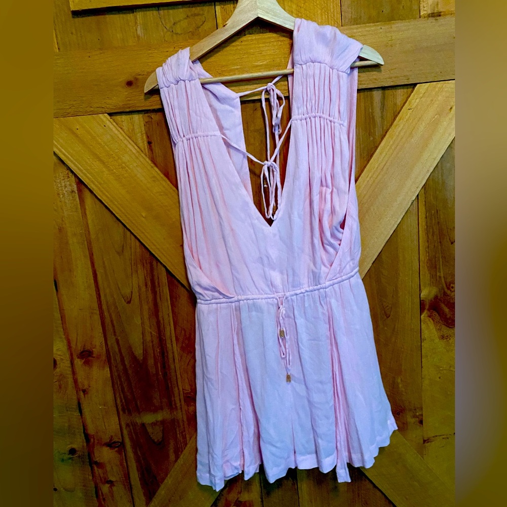 Free People size Medium pink romper. Fits TTS. Gauzy and cool. NWT.